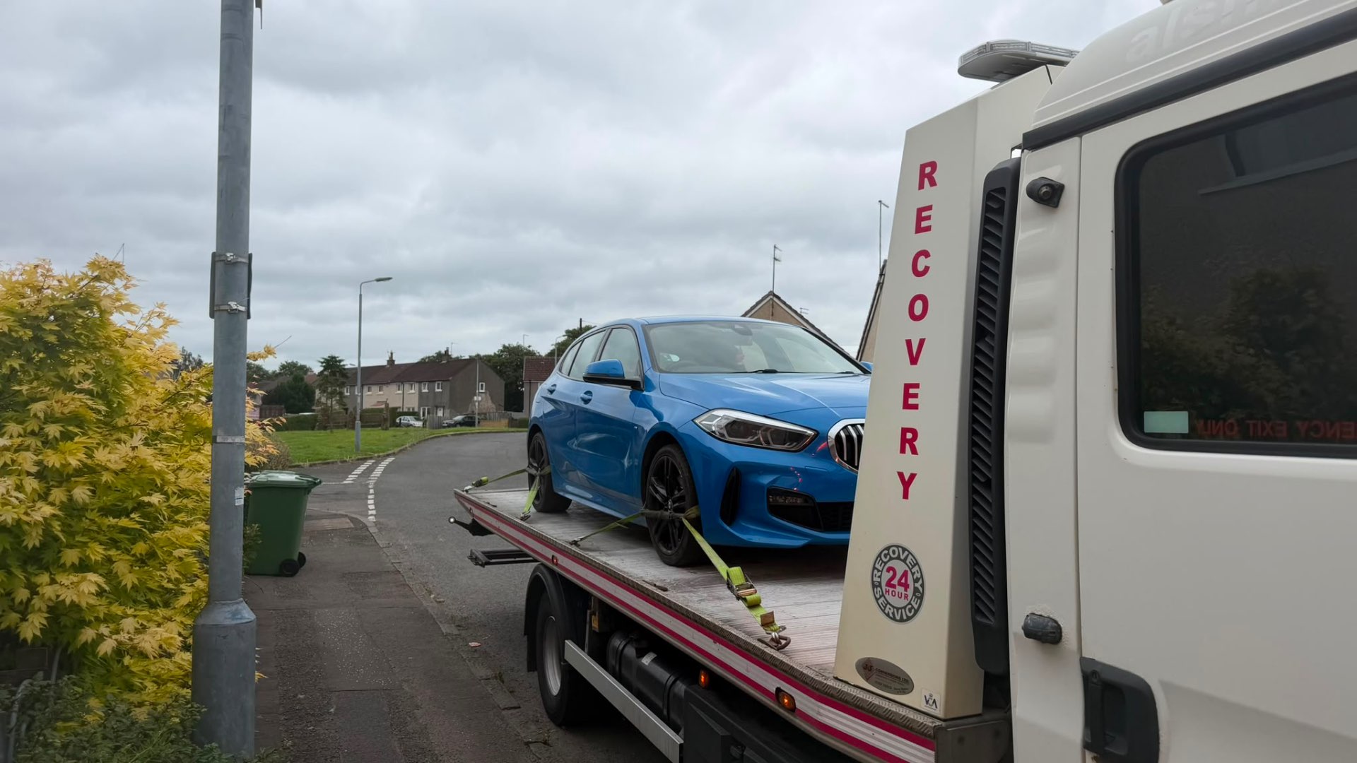 Blue BMW 1 Series M Sport loaded on MZL recovery flatbed