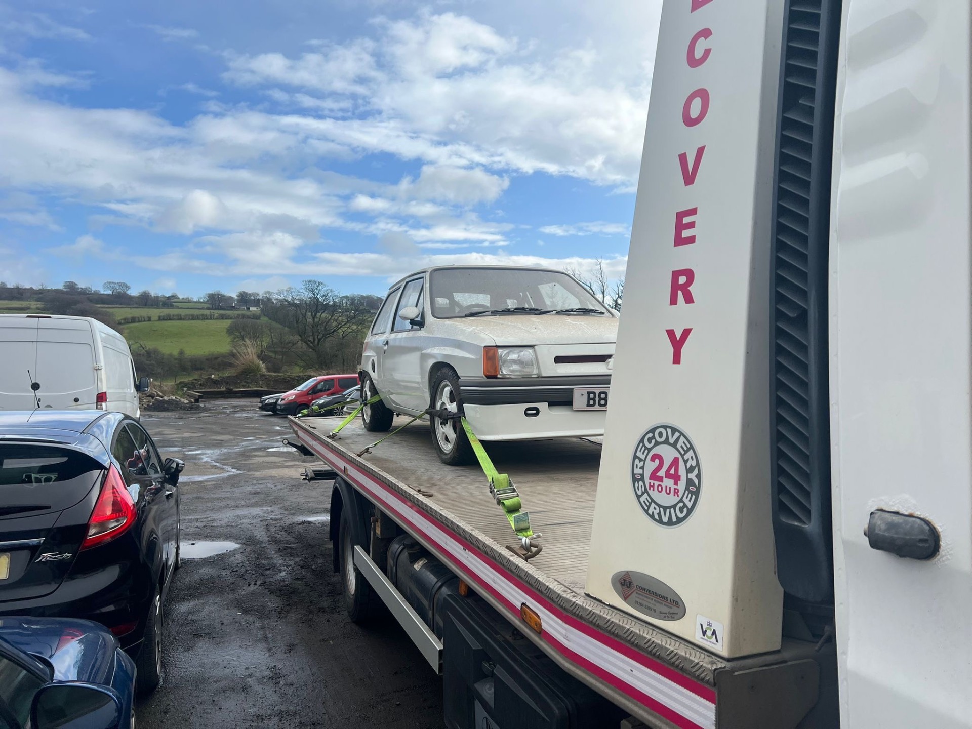 Vehicle transport — Vauxhall Nova on flatbed recovery