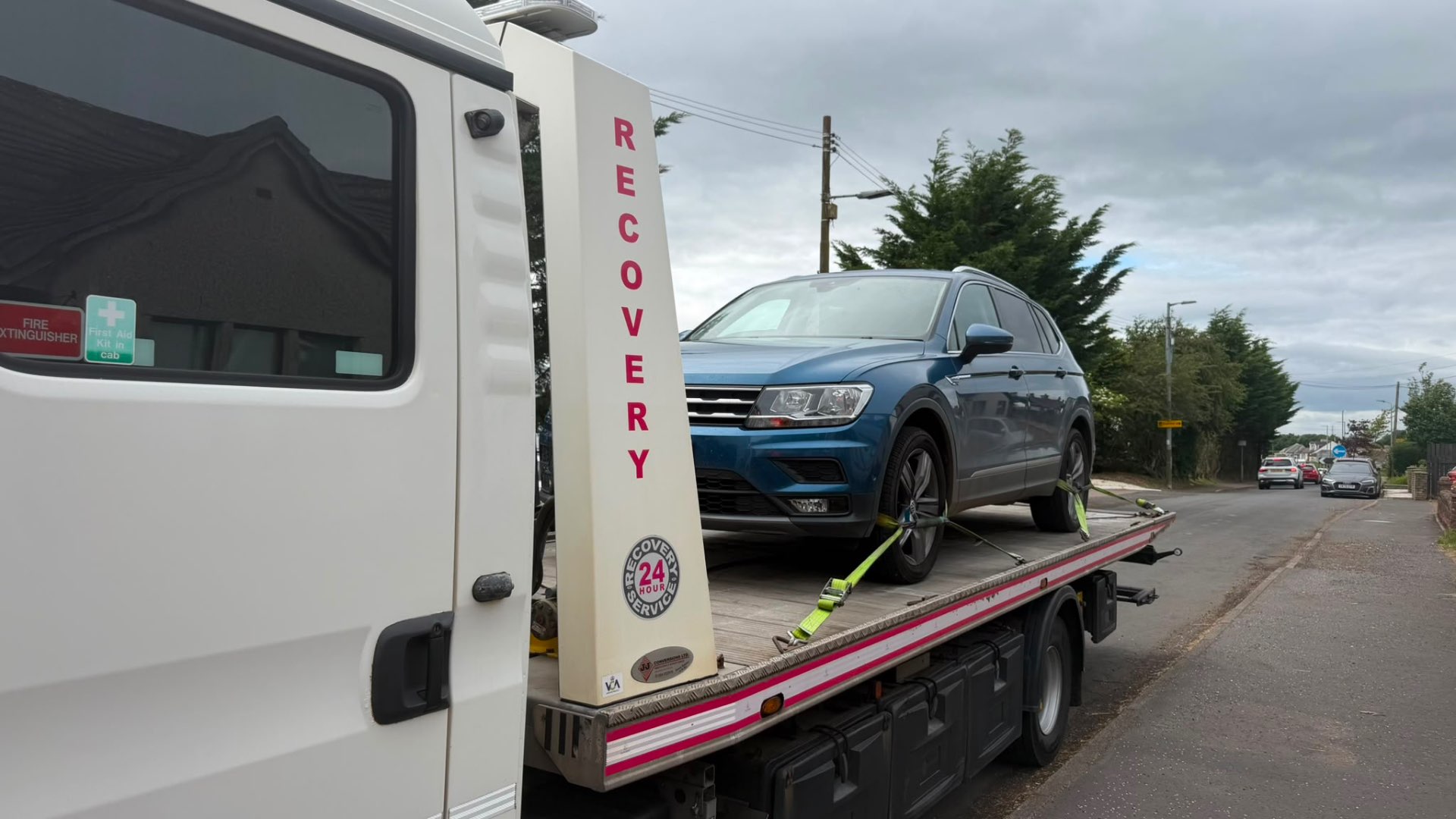 Blue VW Tiguan Allspace secured on 24-hour recovery flatbed