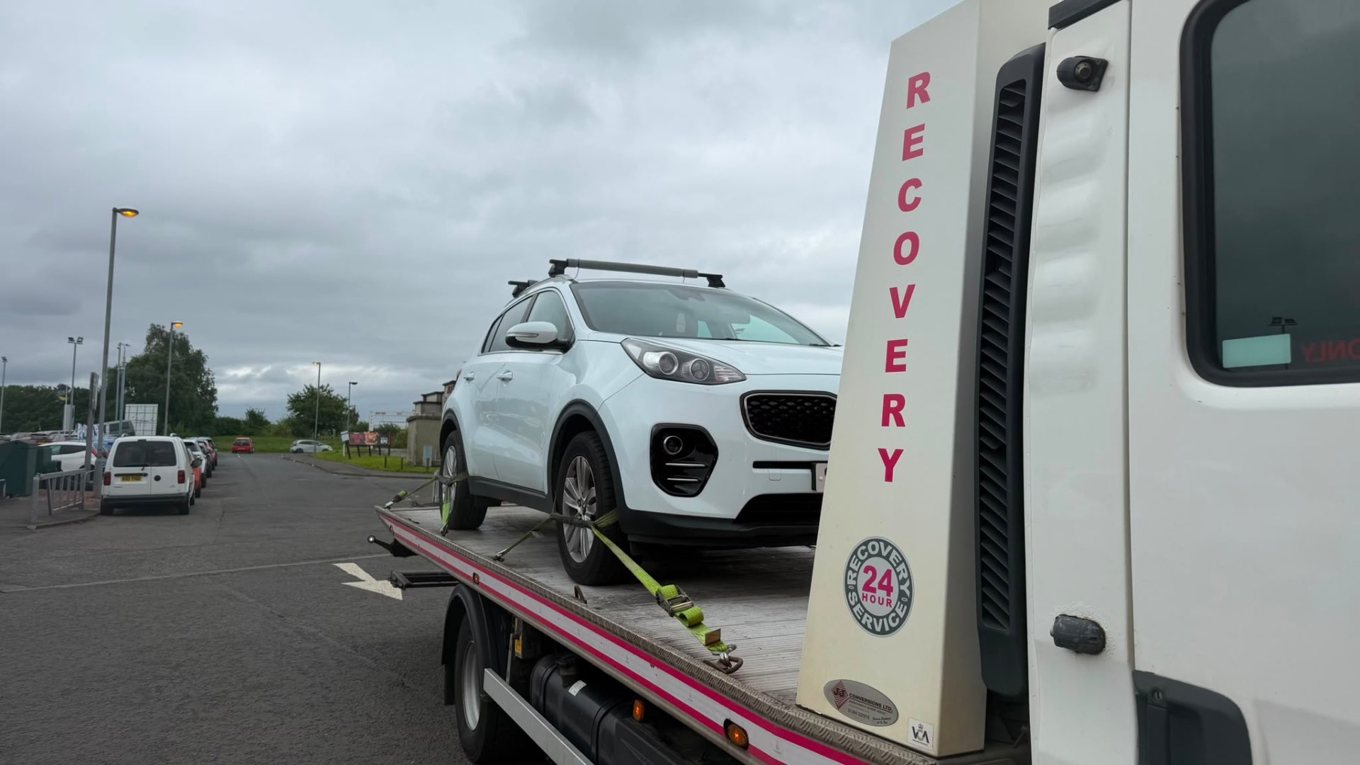 White Kia Sportage loaded on MZL 24-hour recovery flatbed
