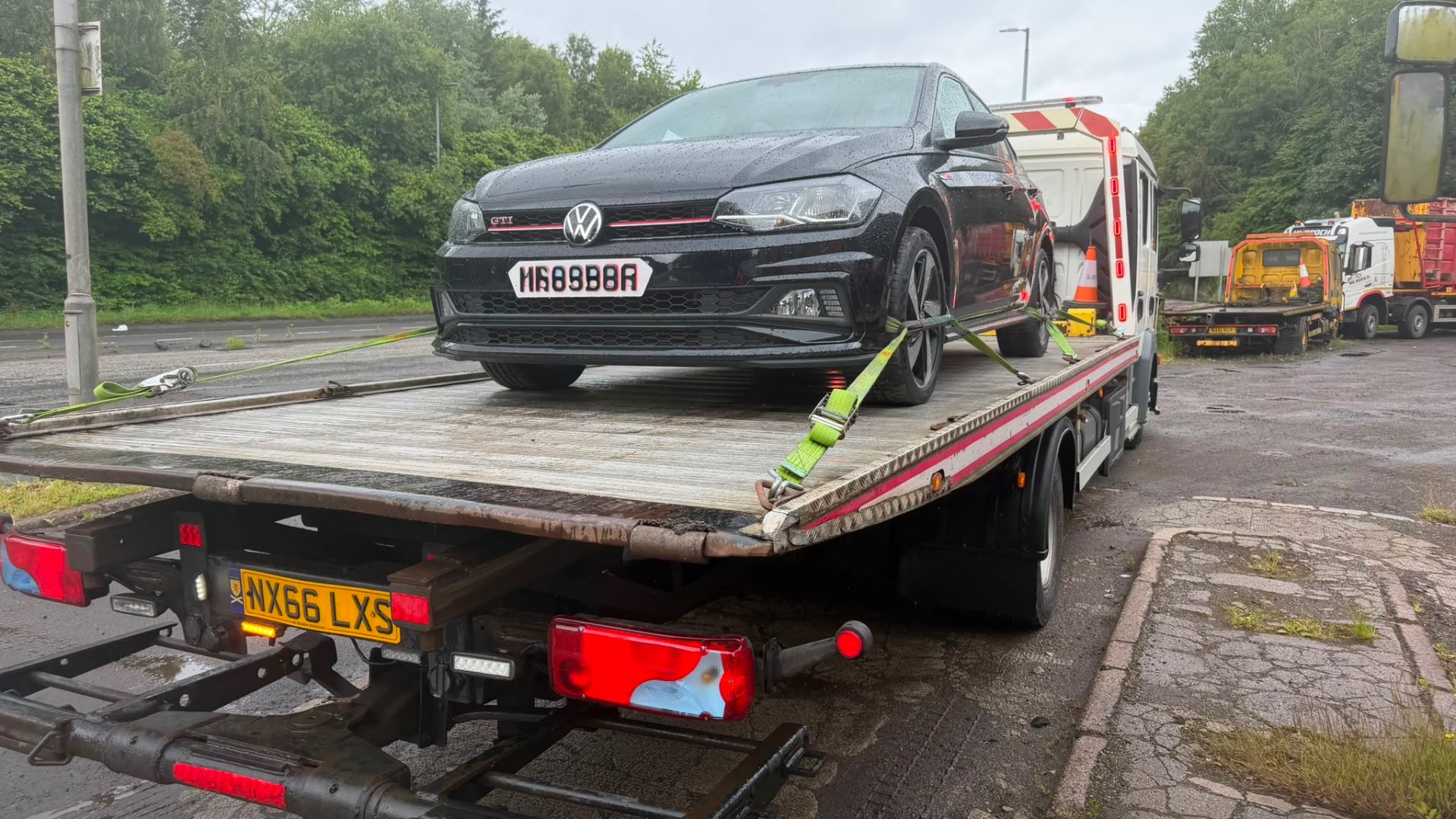 Black VW Polo GTI loaded on MZL flatbed recovery truck after non-fault accident