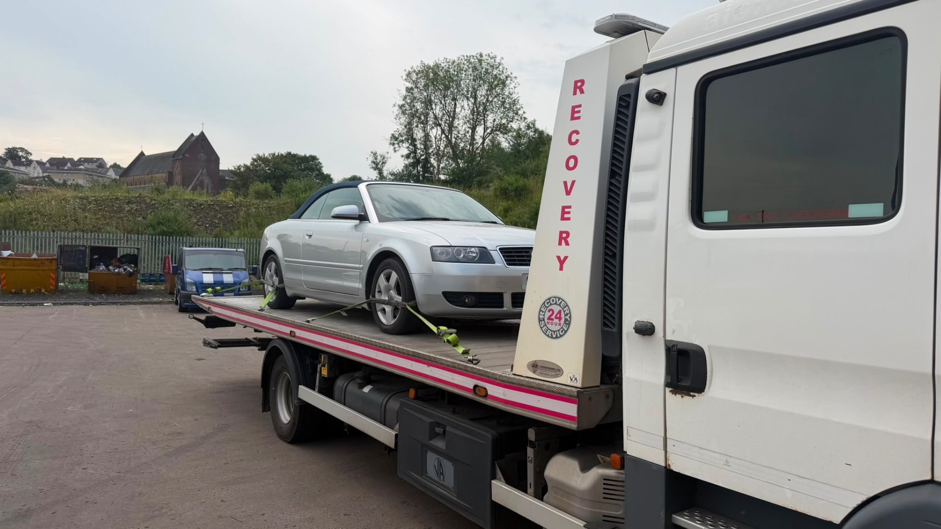 Silver Audi A4 Cabriolet loaded on MZL 24-hour recovery flatbed